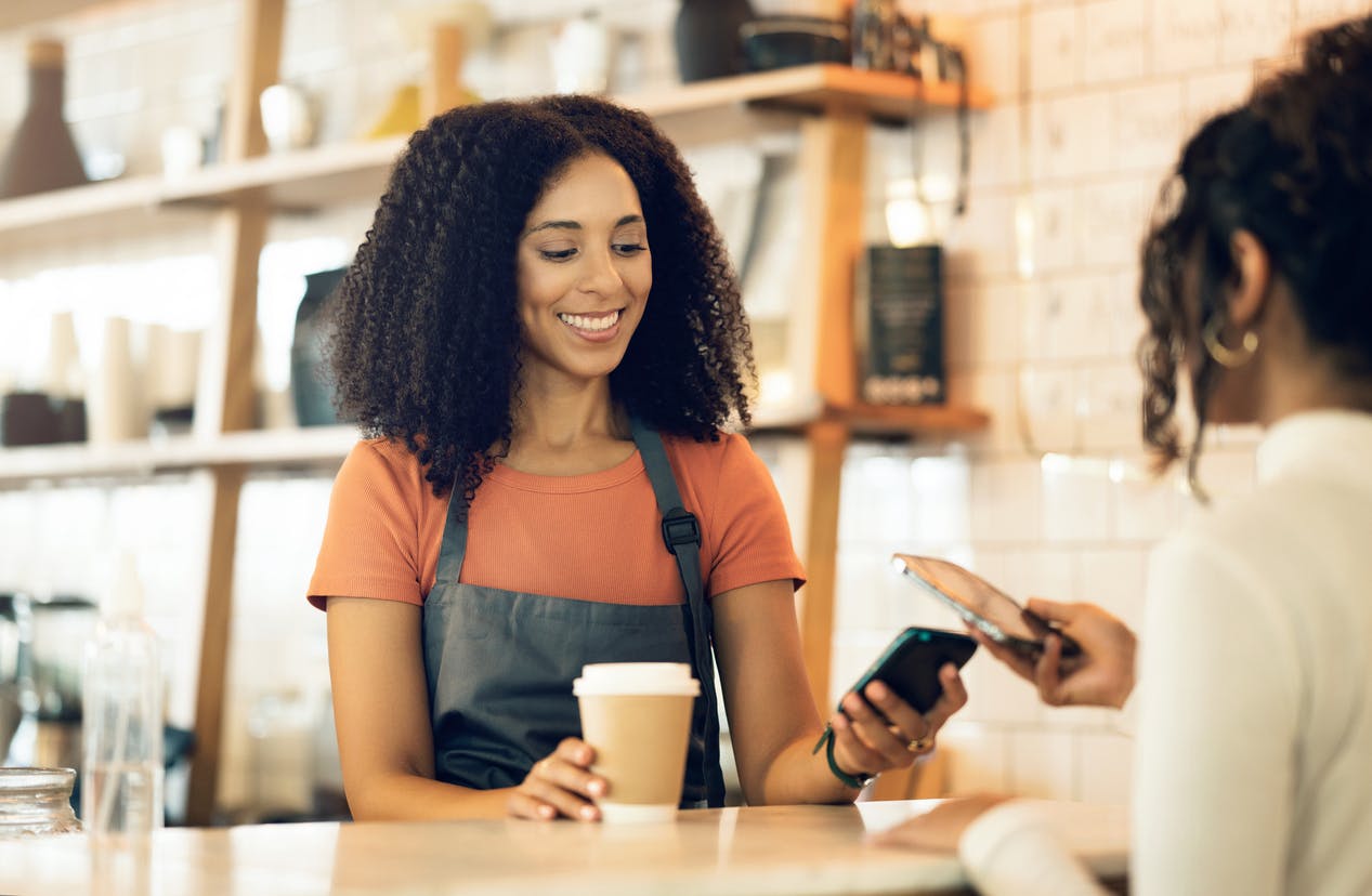 woman paying with contactless payment