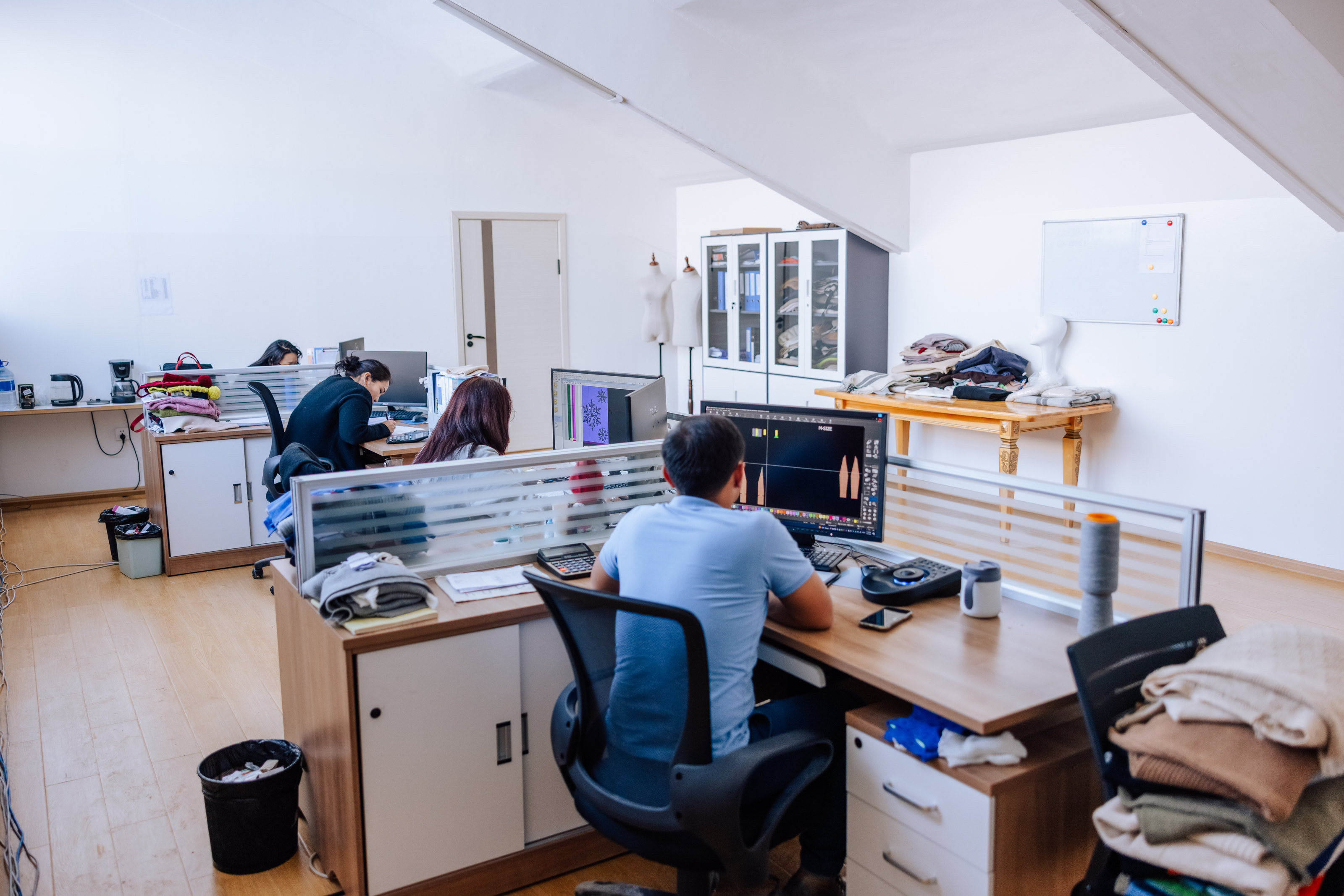 A product development team working with digital patterns and samples.