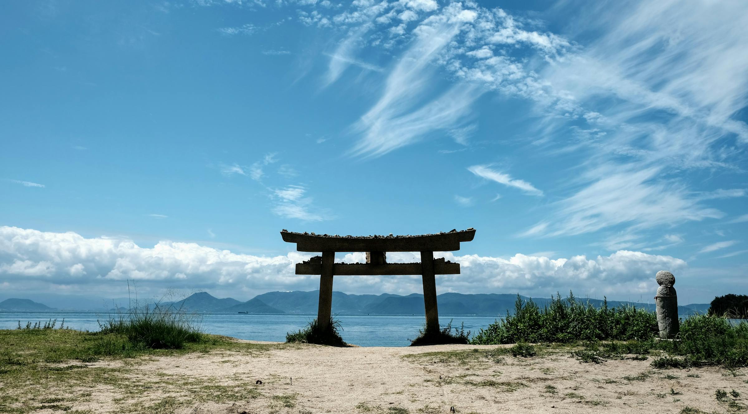 Torii Gate in Japan near the ocean with islands
