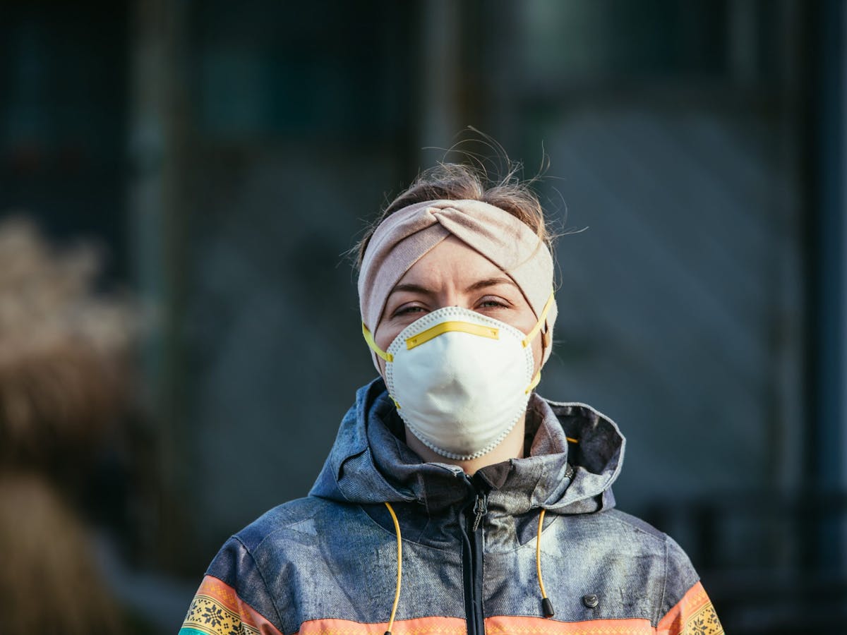 Woman working outside with a mask on