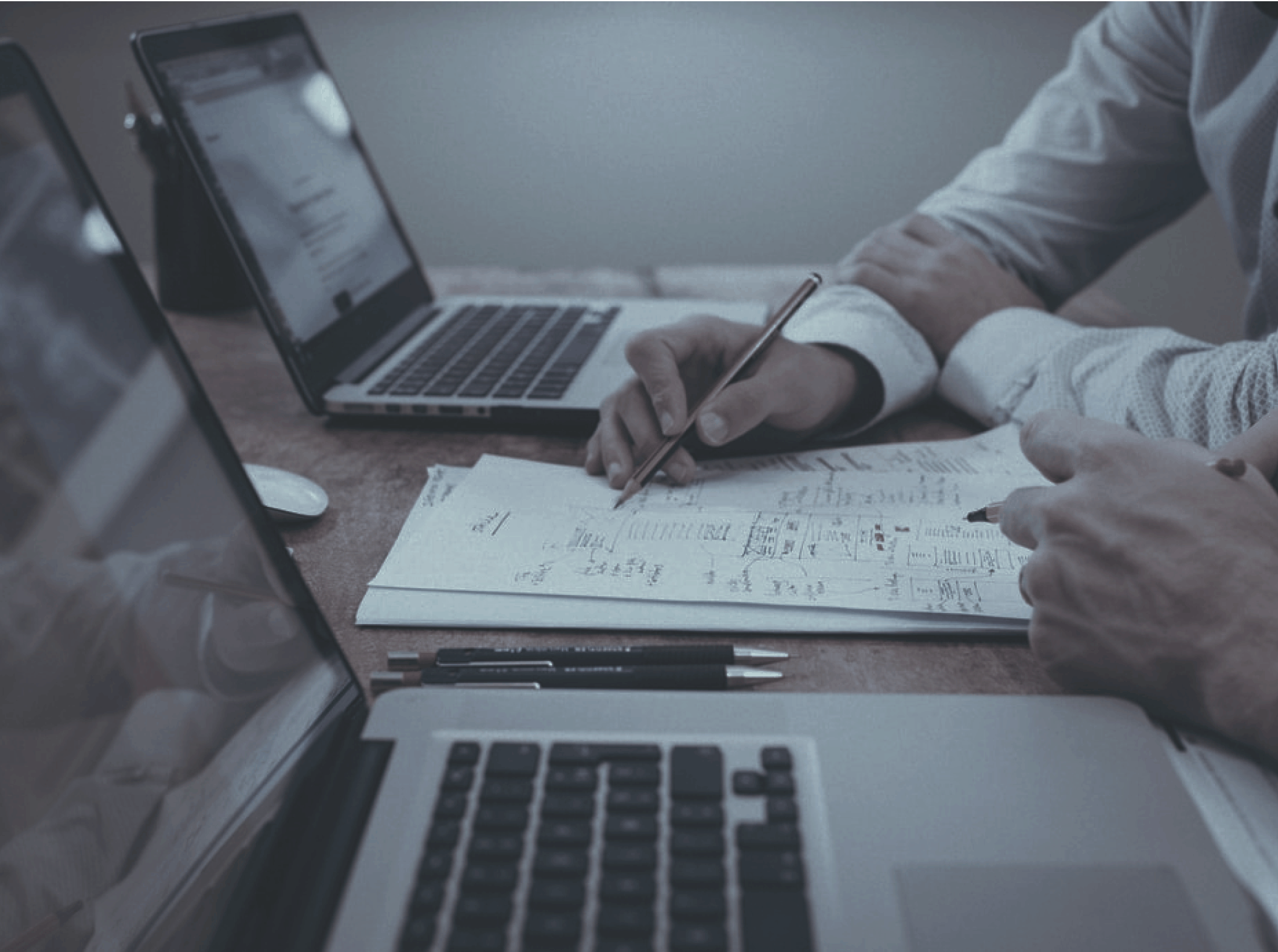 Two people working together on paper