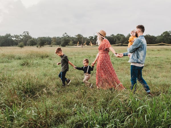 A family walking through a field