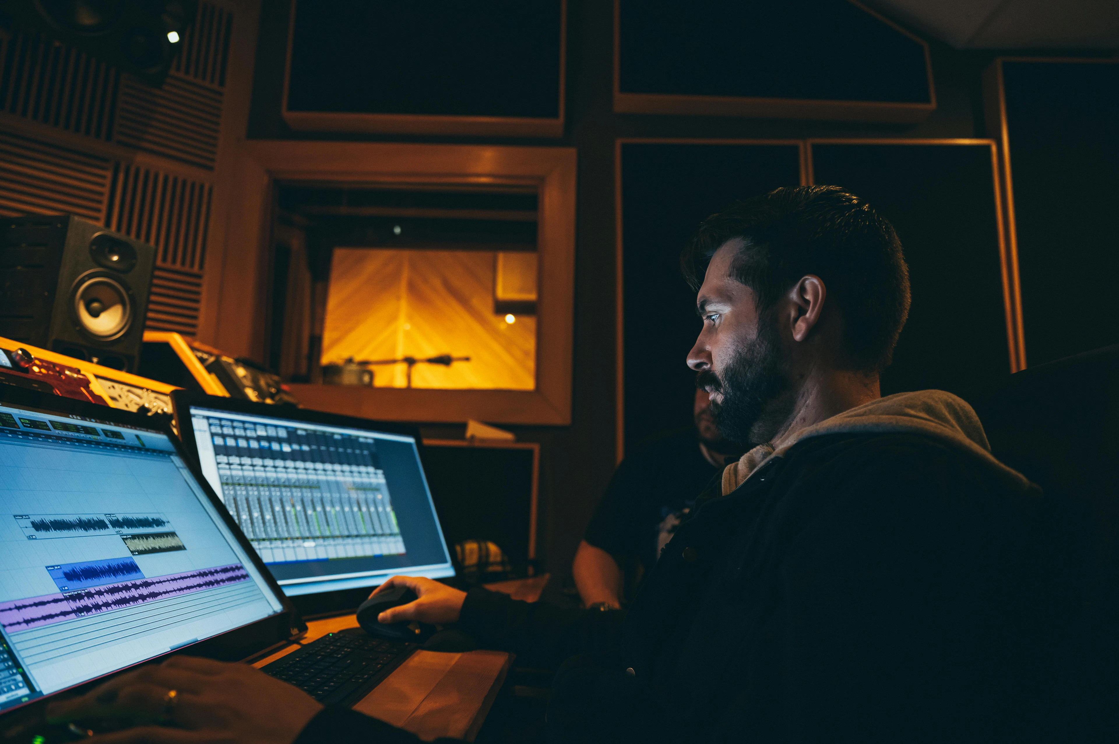 Music production student working with a private teacher
