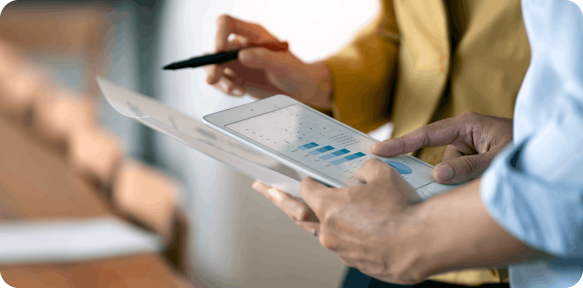 A person holding a white tablet