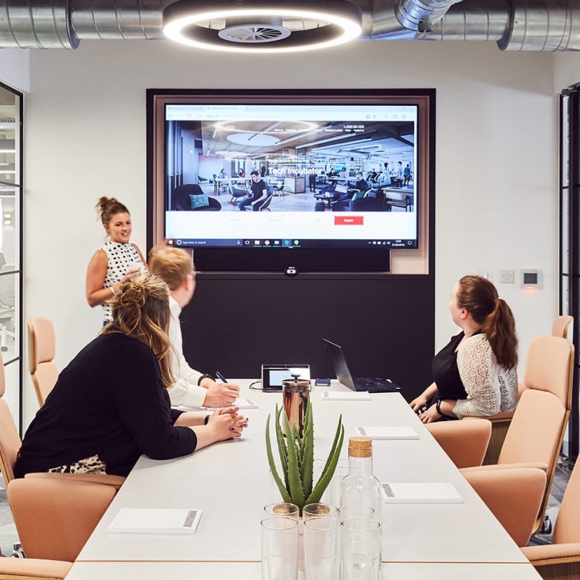 AVM Solutions' team in a meeting room