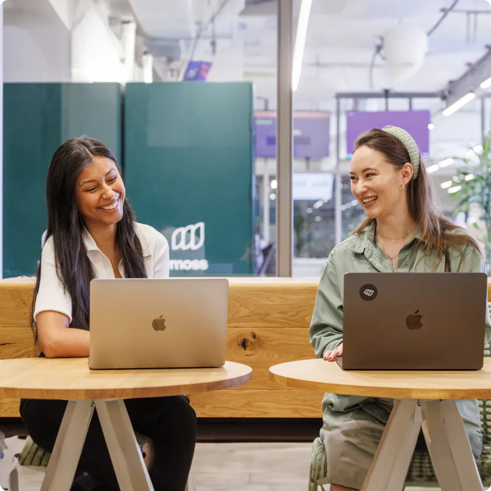 Moss employees with their laptops
