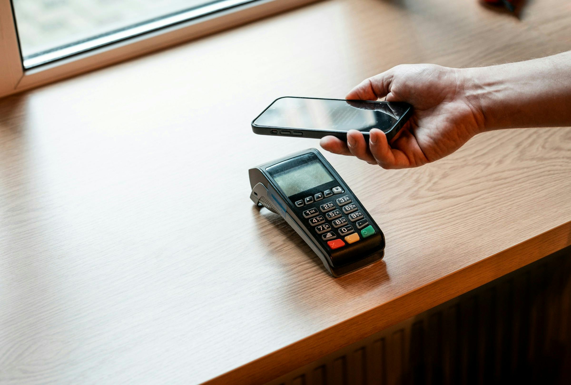 Someone paying with their phone