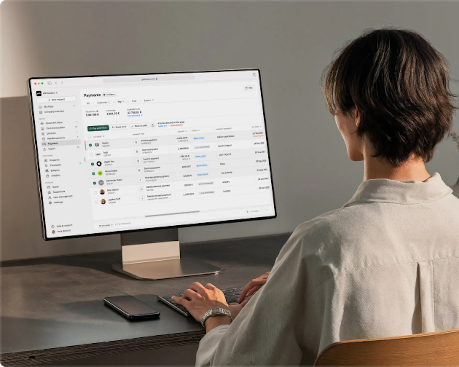 Finance teams person in from of Moss desktop