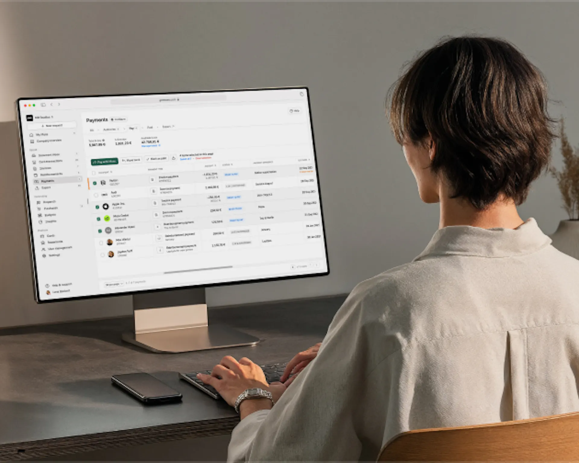 Finance teams person in from of Moss desktop