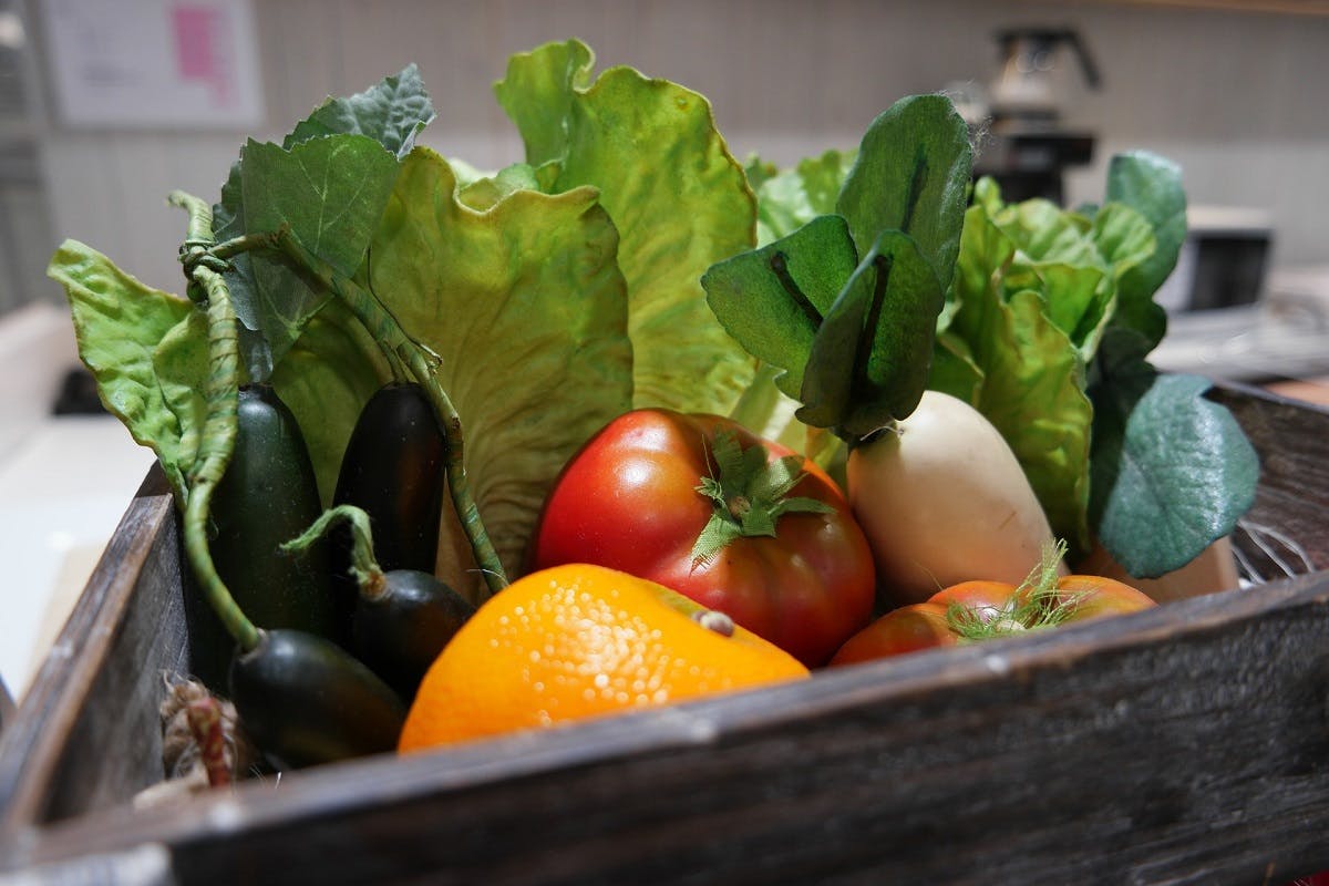 A veg box containing a variety of fresh, seasonal and local fruit and vegetables. A veg box is an simple and convenient way to eat the seasons and eat locally.