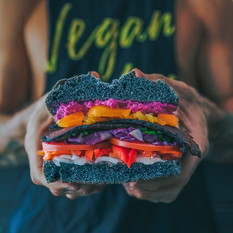 A deliciously packed vegan burger. Choosing a vegan diet is one way to reduce your carbon footprint significantly.