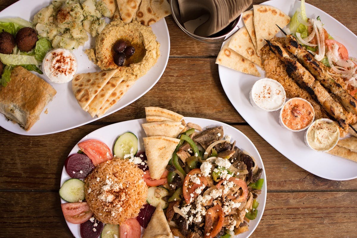 A plate of vegan Greek food with falafel, a staple when being vegan