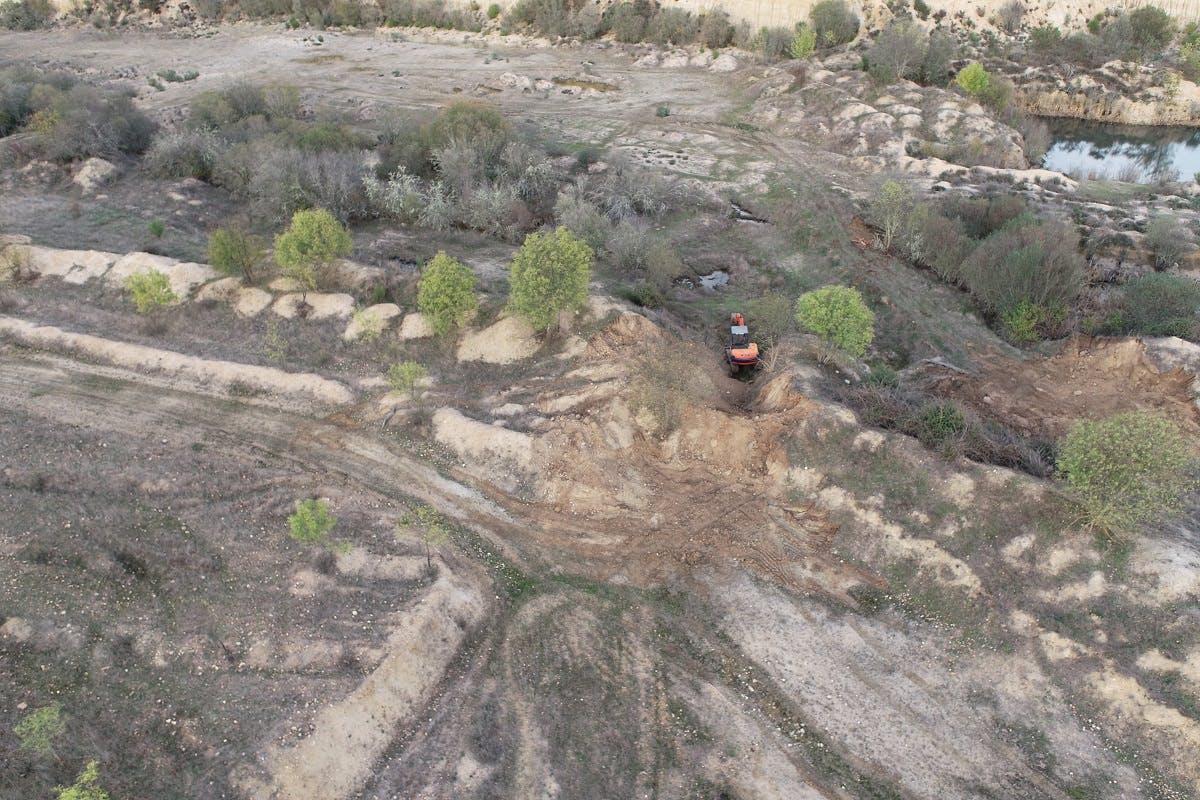 A digger doing earthworks at Paul de Toirões rewilding project in northwest Portugal.