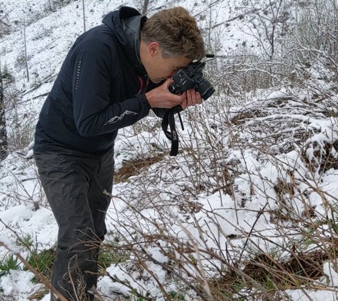 Co-founder Matt takes photos of freshly planted trees after a snowy planting session.