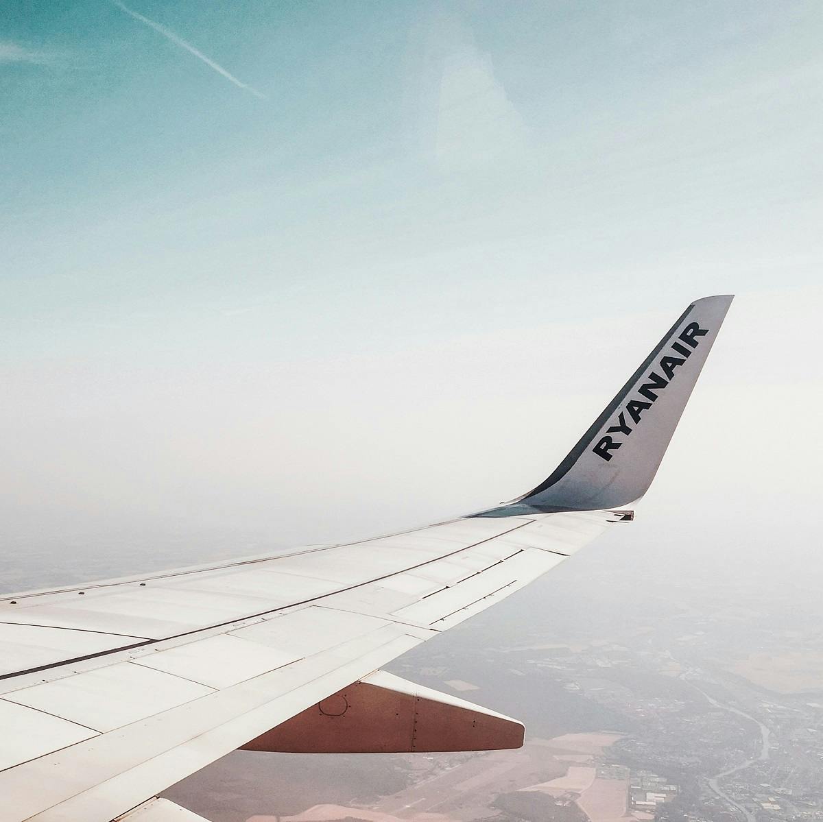 A view of the wing and winglets of a Ryanair plane from inside the cabin. The use of winglets contributes to more sustainable flying.