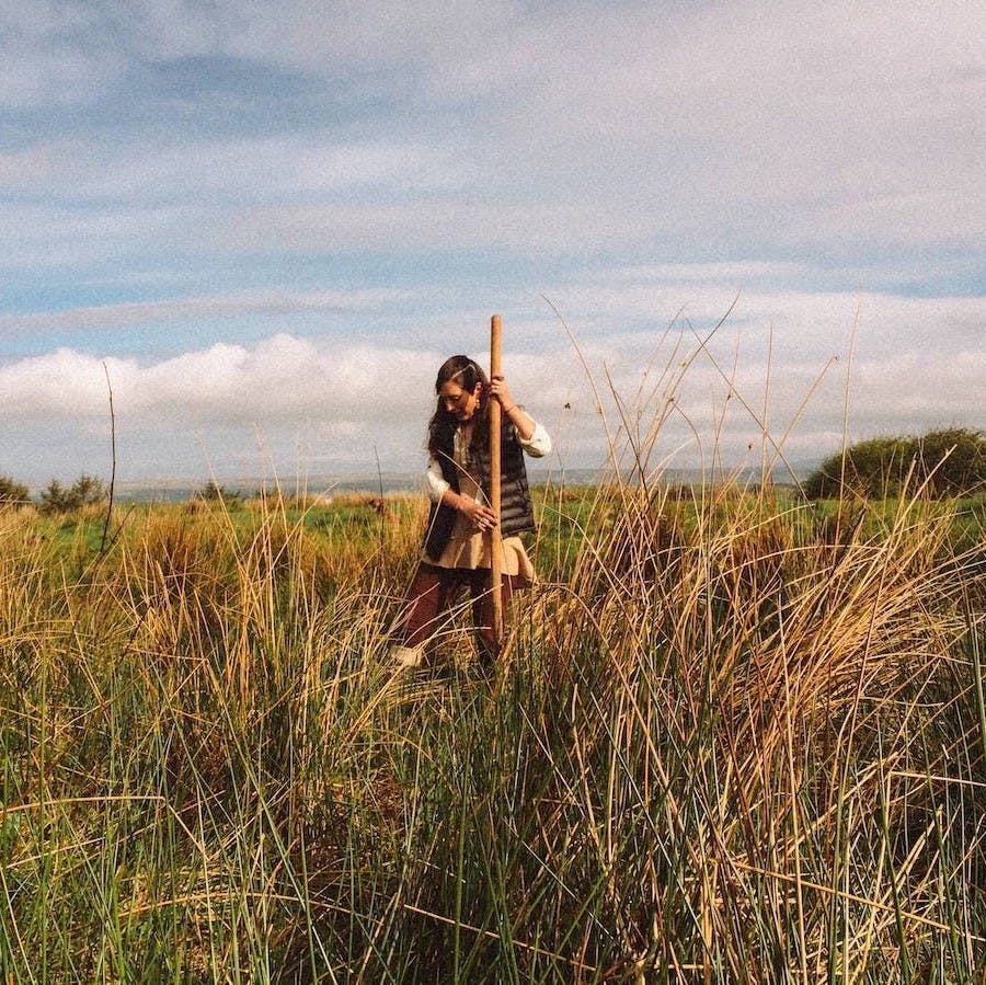 A woman stands in the tree planting area at our reforesting Ireland project.