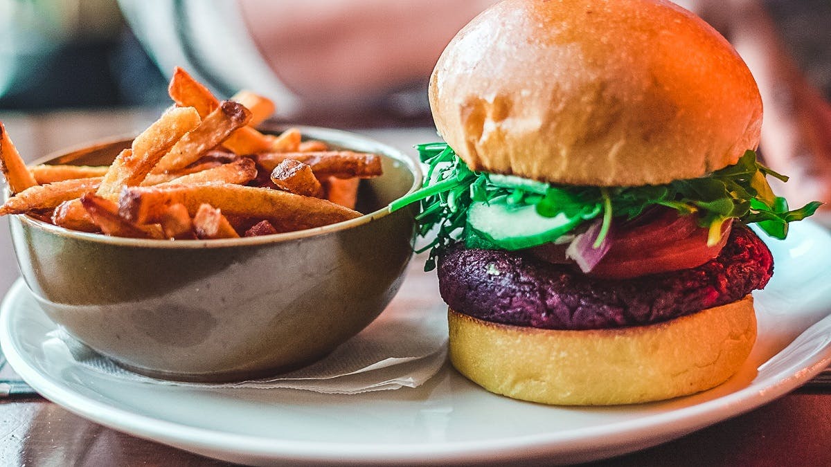 A delicious vegan beetroot burger and sweet potato fries