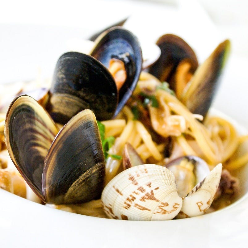 A delicious looking plate of mussels and pasta. Microfibres and microplastics are now being found in shellfish