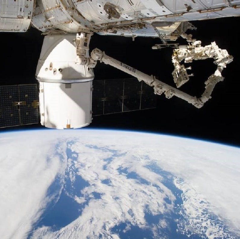 SpaceX dragon capsule docking with the International Space Station. The data collected from this mission will inform carbon sequestration estimates of above ground biomass around the world.