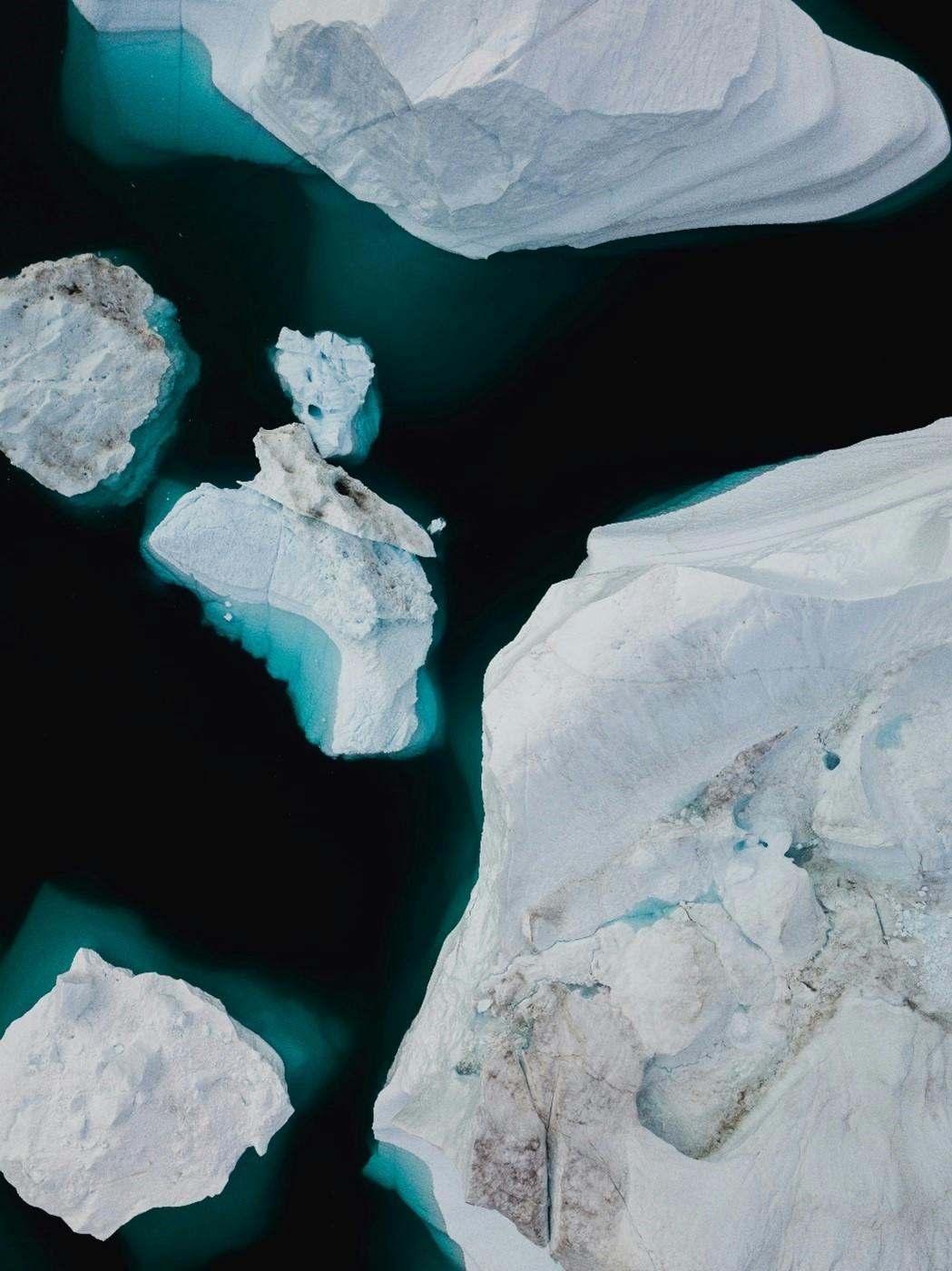 An impressive aerial image of floating sea ice. Climate change is causing a loss, on average, of 150 to 280 billion tons of ice per year in Greenland and Antarctic.