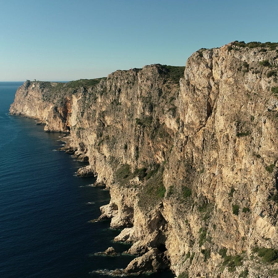 Bird's eye view of the dramatic cliffs of Cabo Espichel rising about 150 m above the Atlantic ocean.