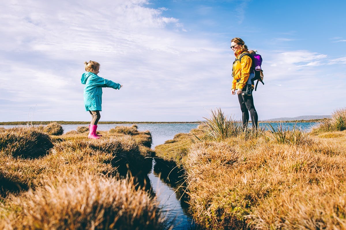 A mother and daughter out in the countryside. Getting outside and into nature is key to battling eco anxiety. 