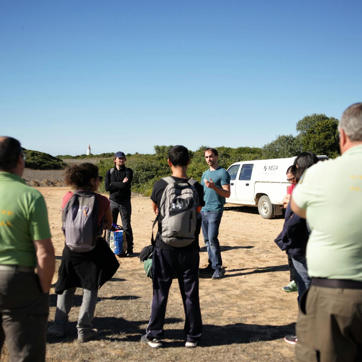 Tiago, conservation biologist at Mossy Earth, giving a briefing to a crew of volunteers at the project site.