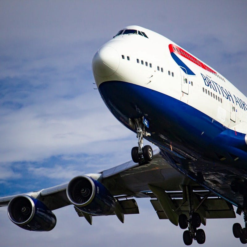 A British Airways Boeing 747 coming into land . To ensure more sustainable air travel, opt for direct flights to minimise the additional fuel heavy take offs and landings.