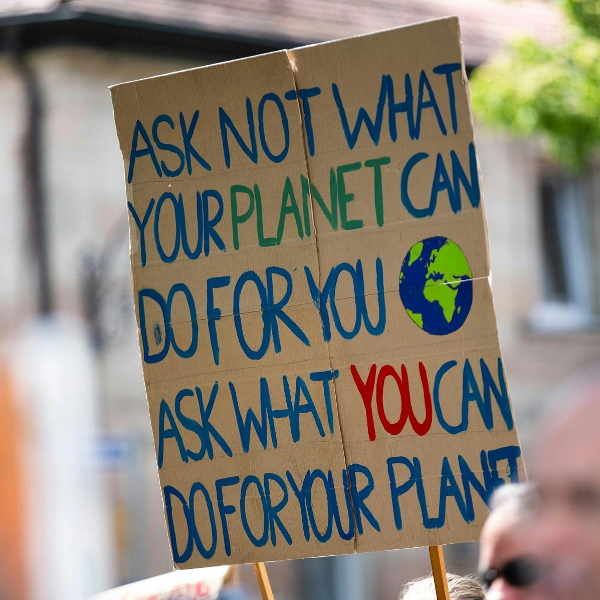 A climate action protest sign