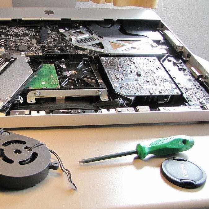 A laptop being repaired.  To minimise the environmental and ethical impact of a laptop, is to keep your current one in circulation longer. 