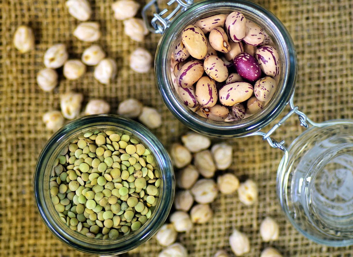 Going vegan and the protein question. Here are two glass jars containing green lentils and kidney beans, just two easy sources of protein.