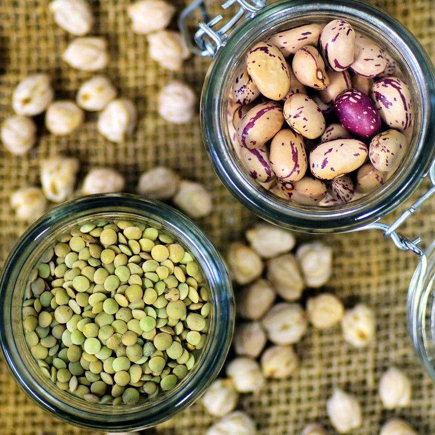 Going vegan and the protein question. Here are two glass jars containing green lentils and kidney beans, just two easy sources of protein.