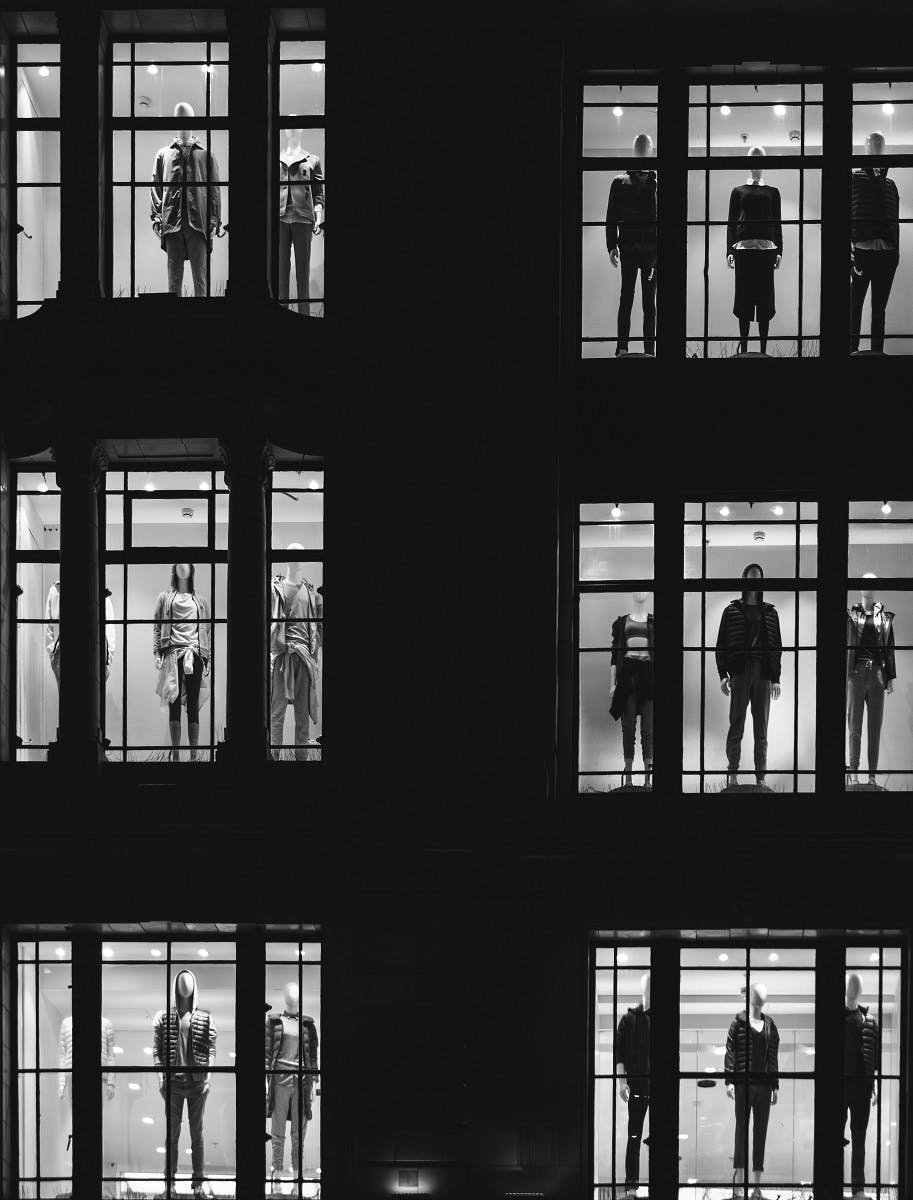 Mannequins in window of a fashion retailer. 