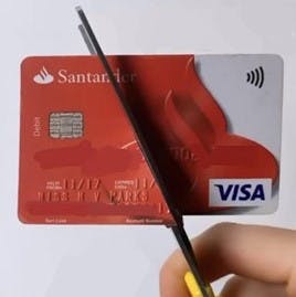 A credit card being cut in half.
