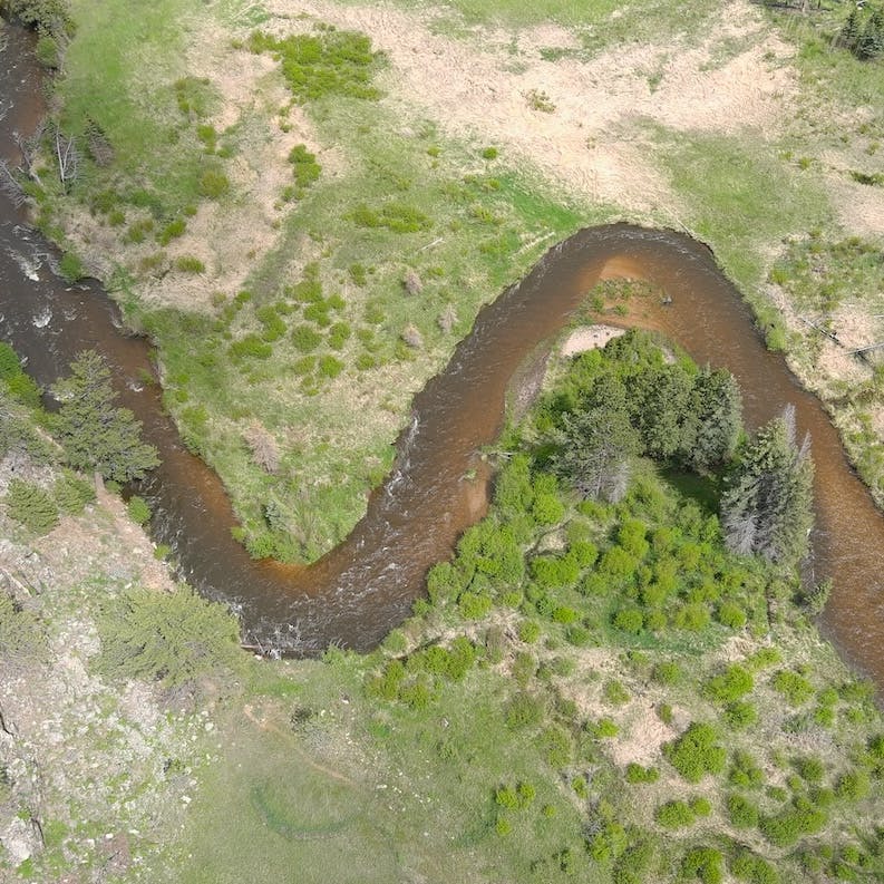 a meander drone shot of the river poudre