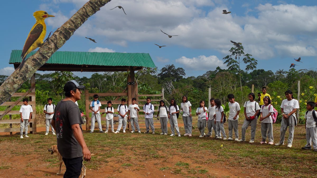 monthly ecuador vlog thumbnail of fredy running a community education event