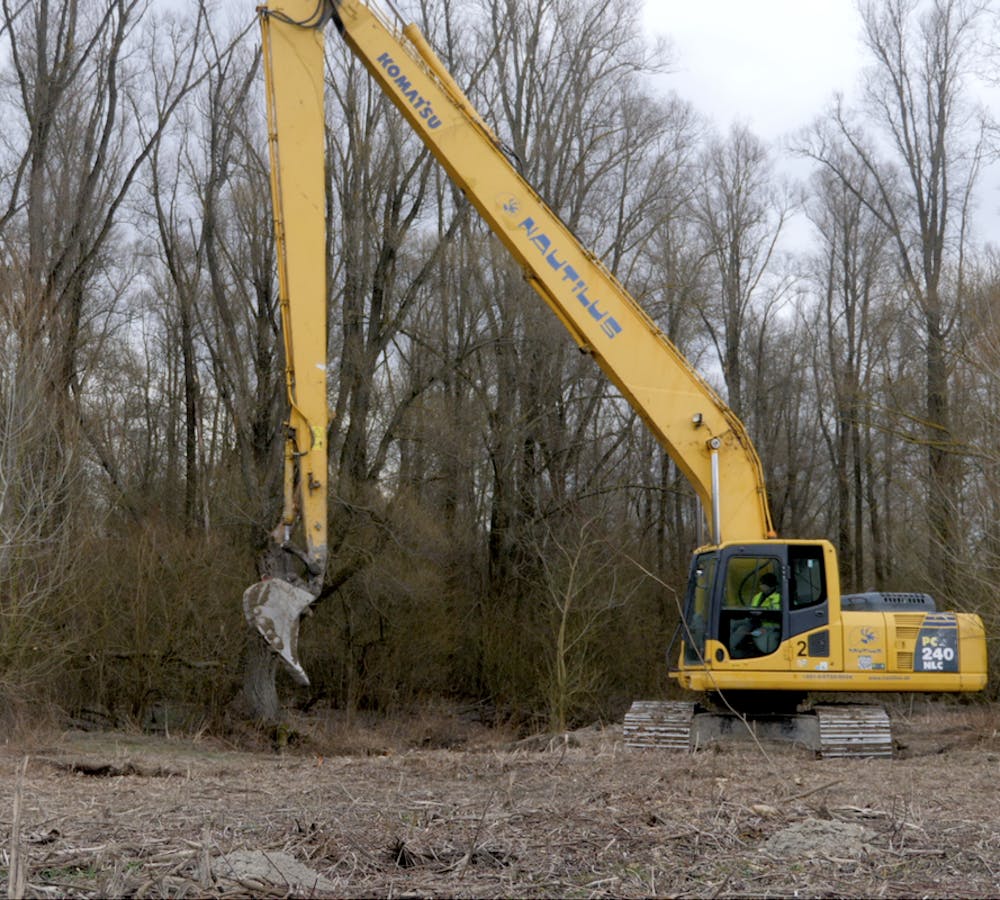 a digger at the Restoring Wetlands Mossy Earth project site.