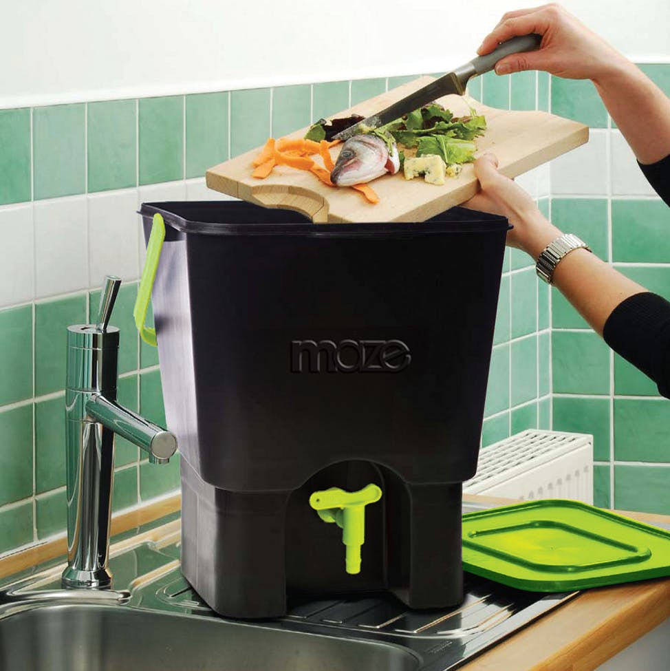 A black and green maze kitchen home composter