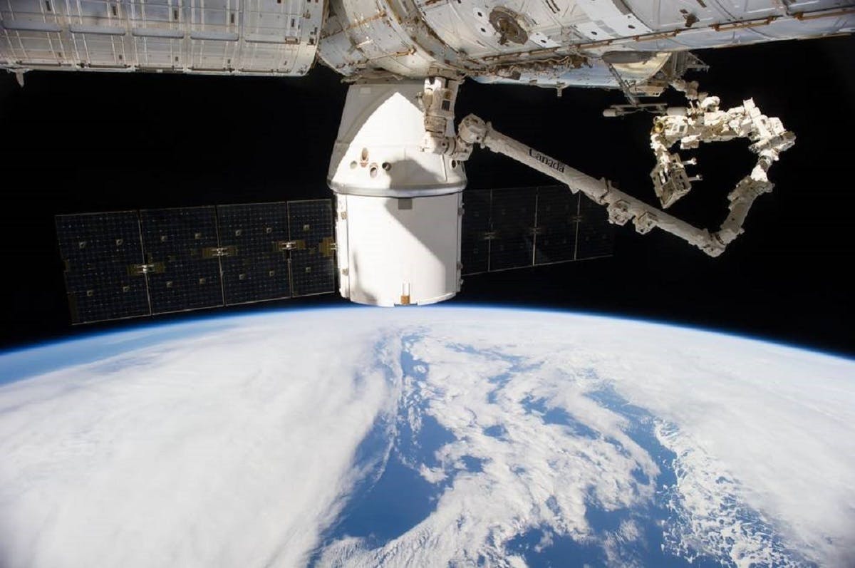 SpaceX dragon capsule docking with the International Space Station. The data collected from this mission will inform carbon sequestration estimates of above ground biomass around the world.