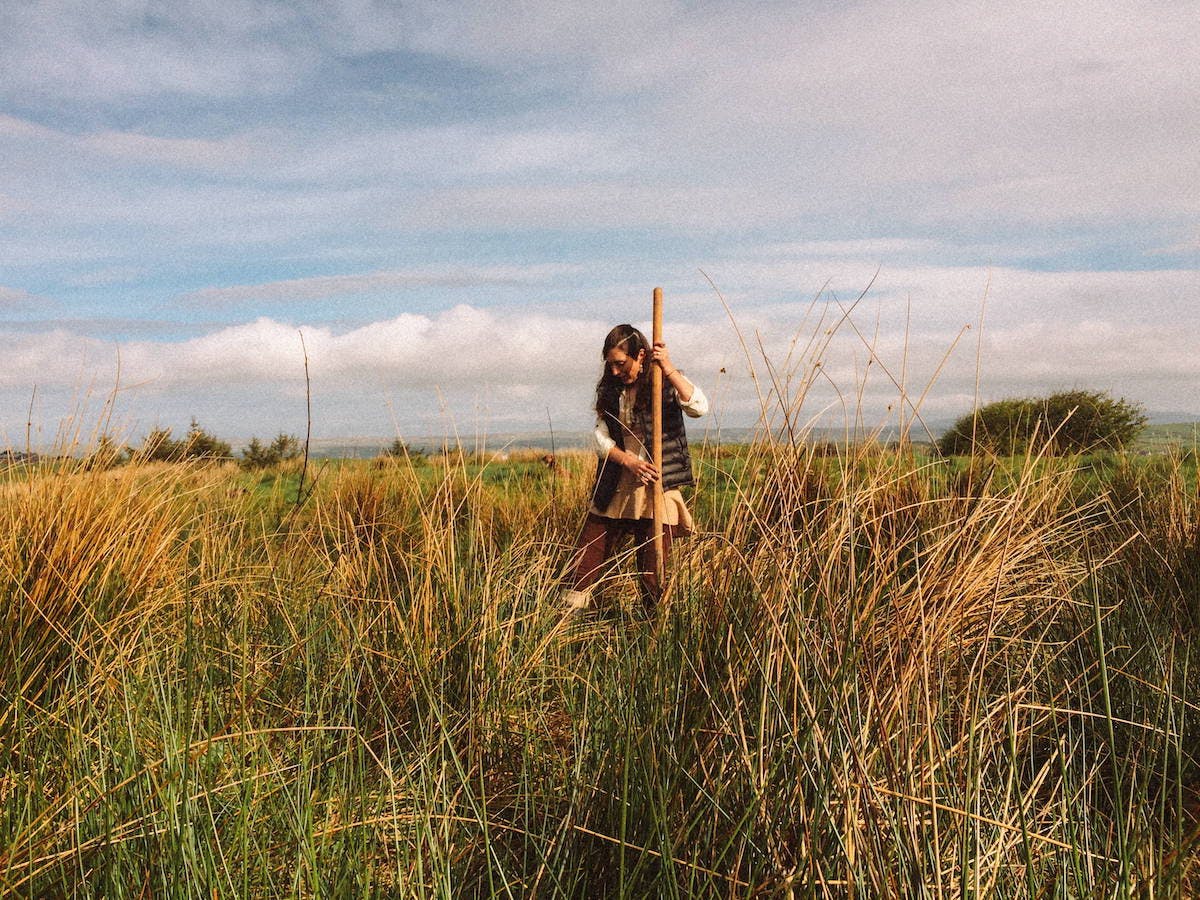 A woman sands in the planting area at our reforesting Ireland project.