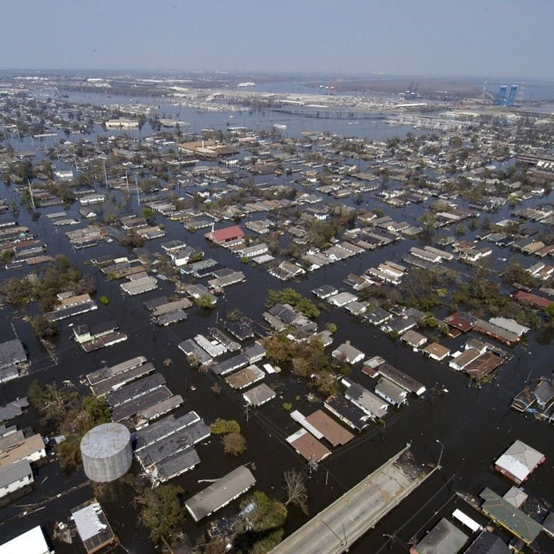 An aerial view of a flooded town. As climate change worsens, we are witnessing ever more floods, that are ever more severe.