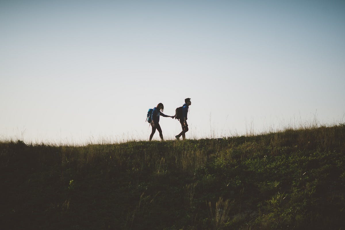 A couple walking in nature.