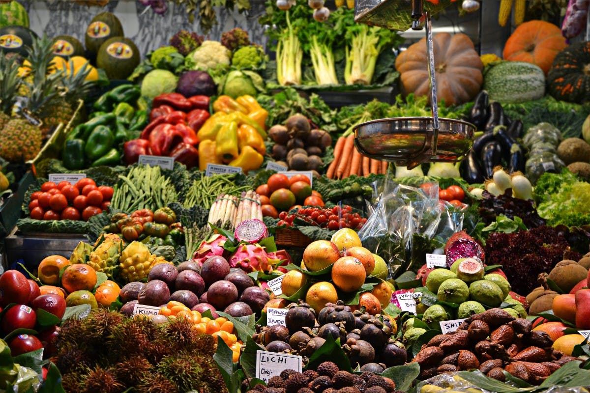 A variety of colorful vegetables displayed at a market stall.