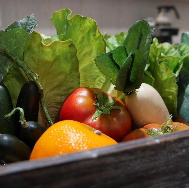 A veg box containing a variety of fresh, seasonal and local fruit and vegetables. A veg box is an simple and convenient way to eat the seasons and eat locally.