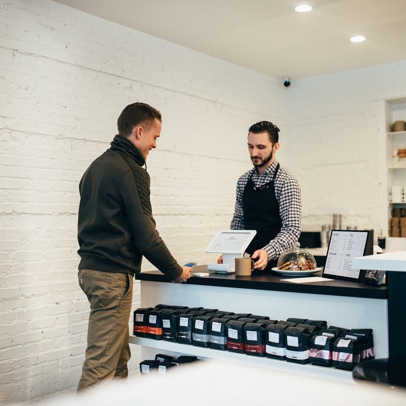 A man exchanging tidal revival app points for a coffee