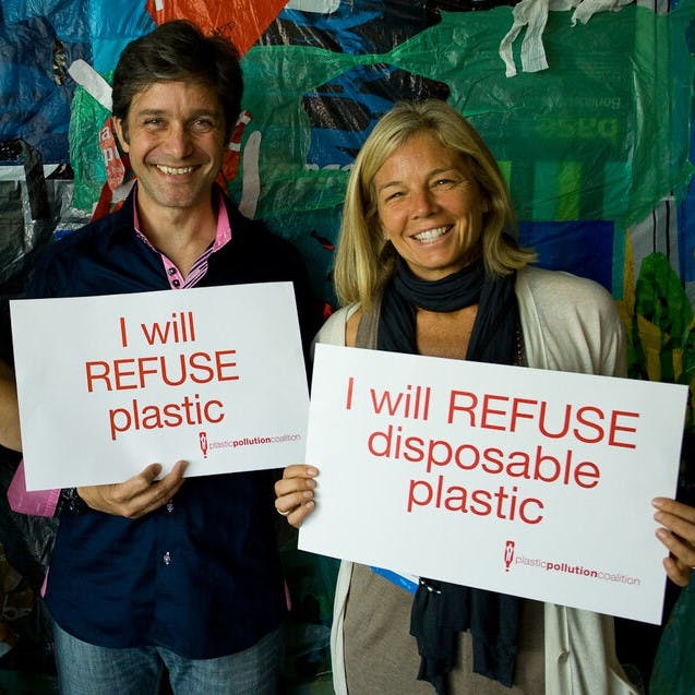 Two people promising to refuse single use plastic