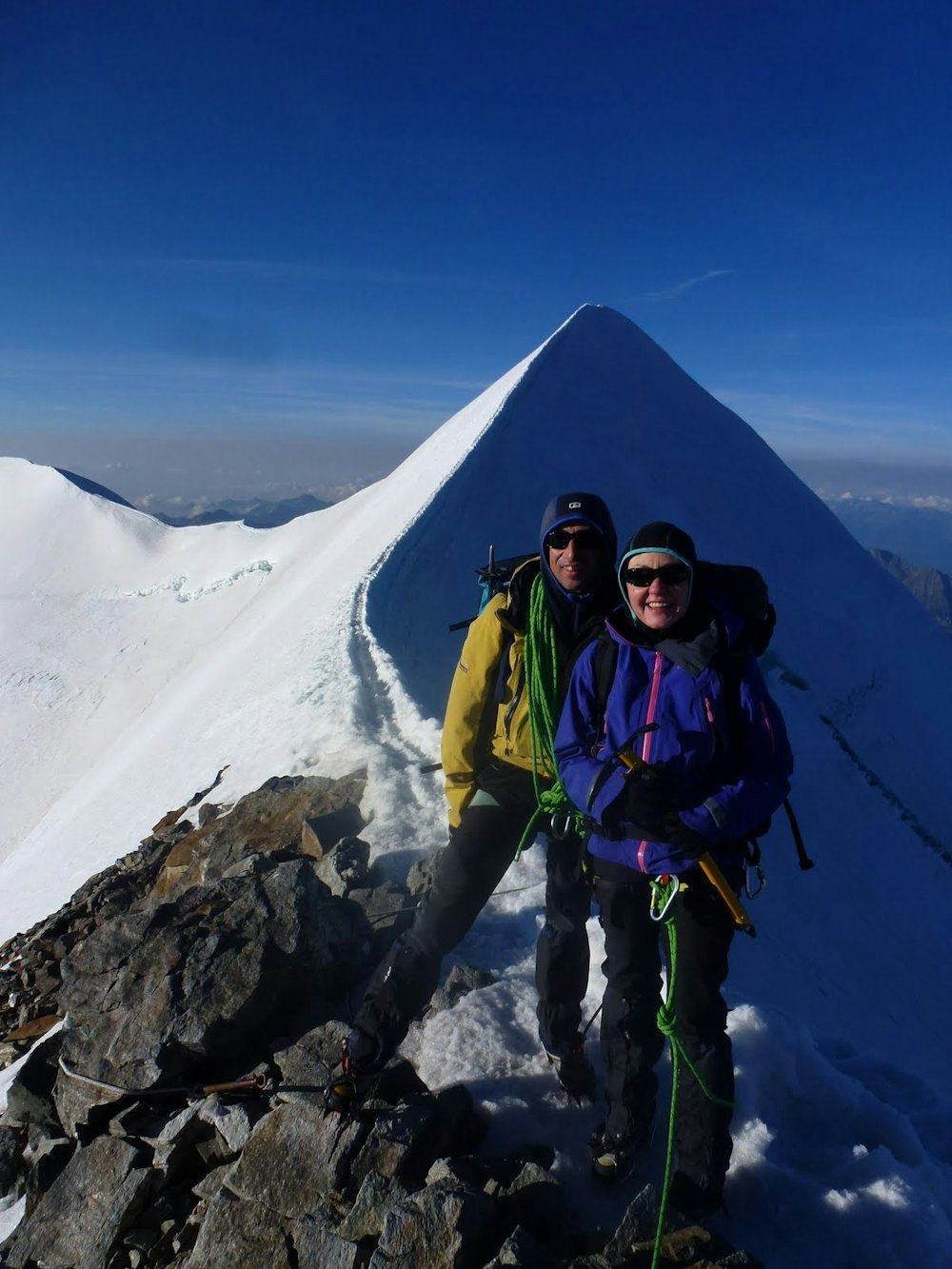 2 people standing on the ridge of Castor