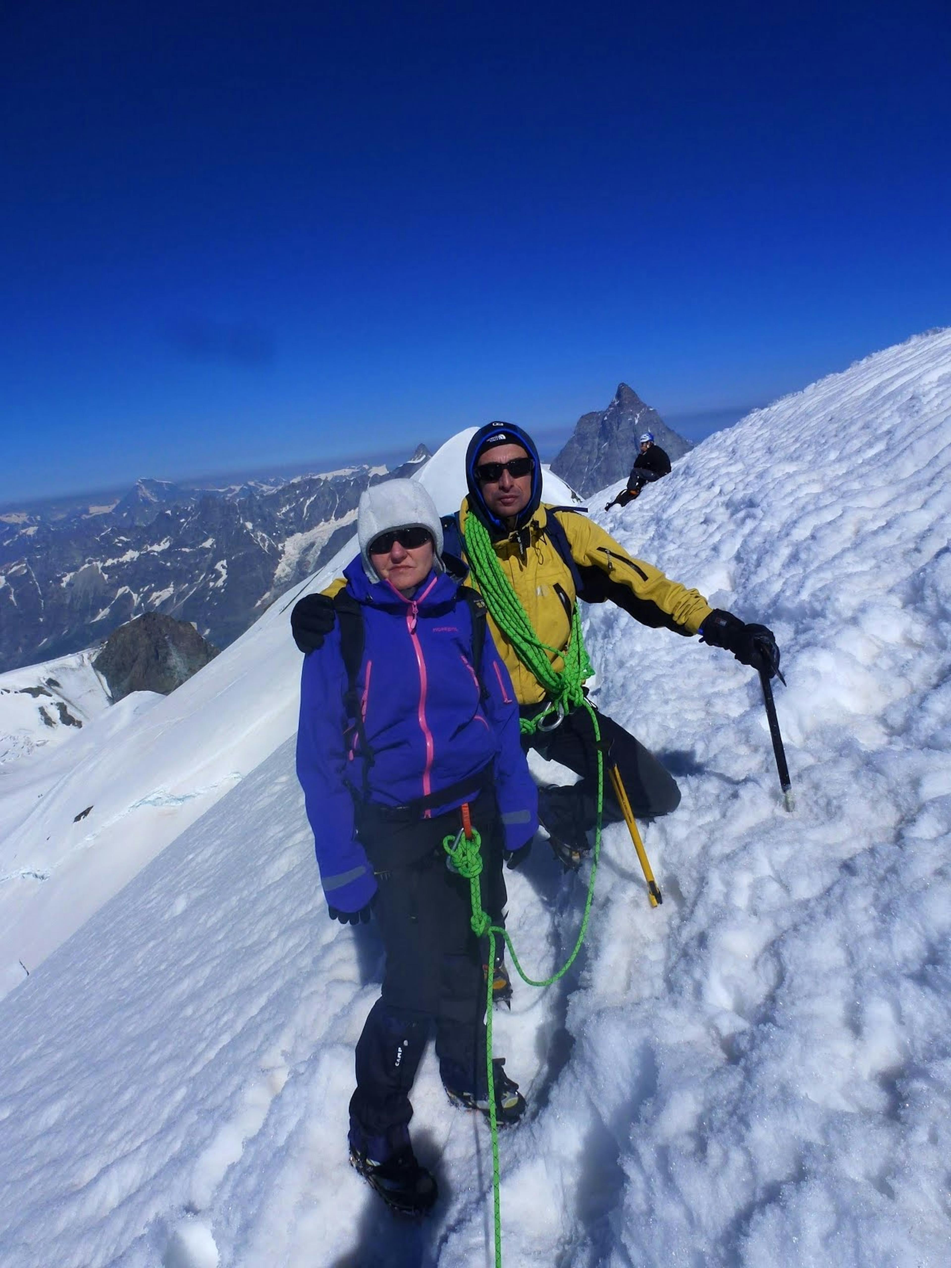 2 people standing on top of West Breithorn with ice-axes