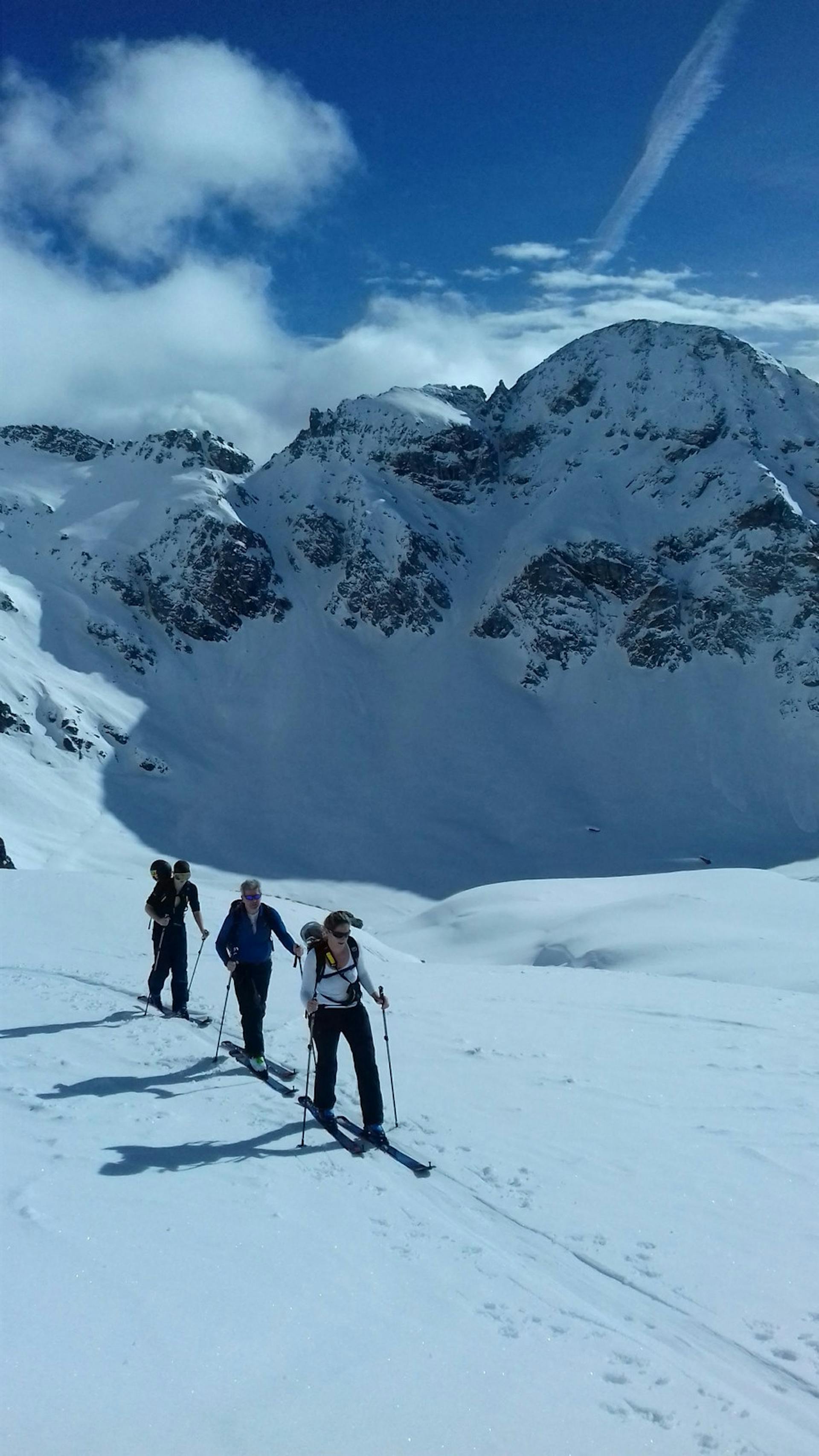 a group of people ski touring