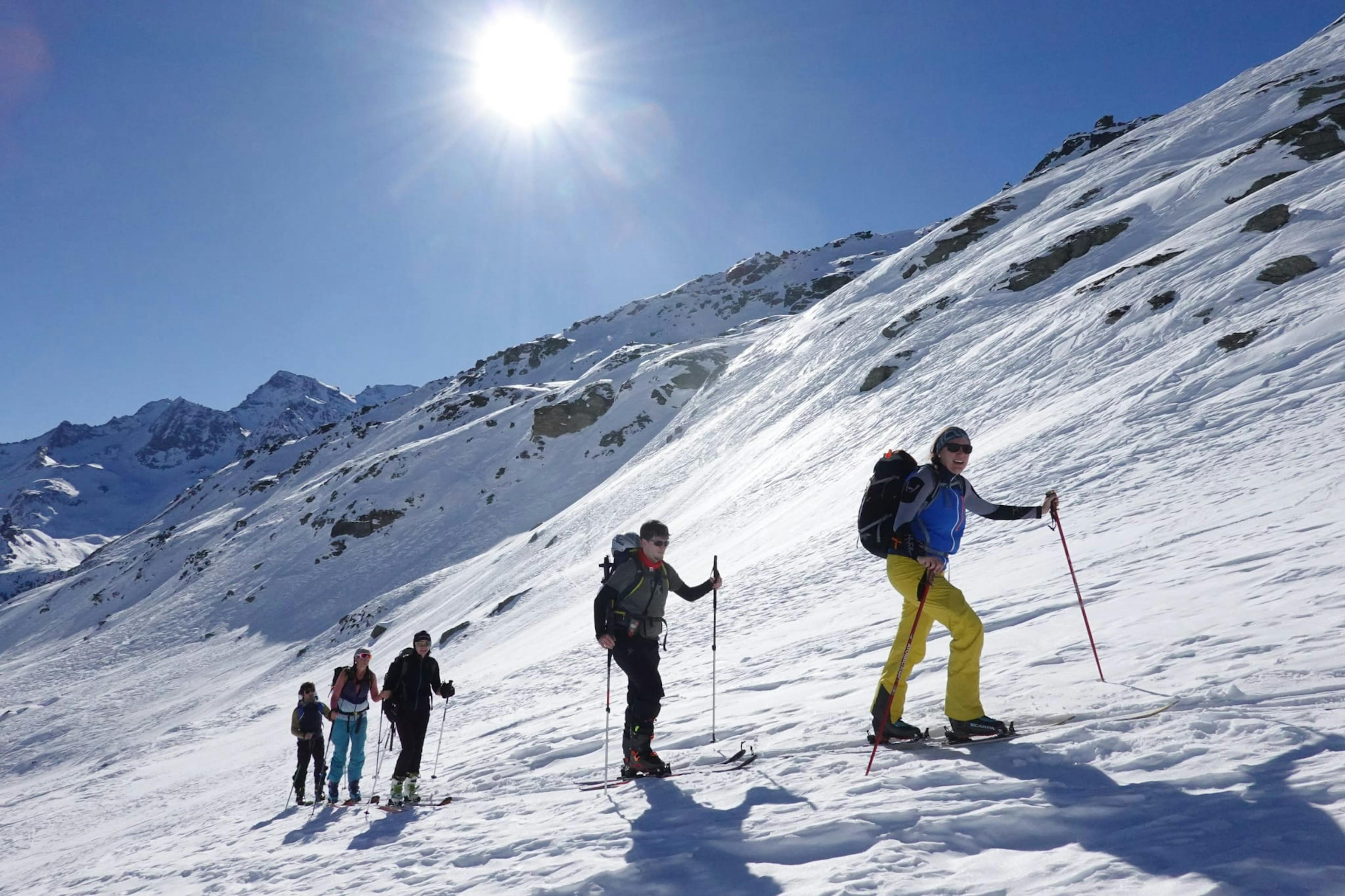 people ski touring